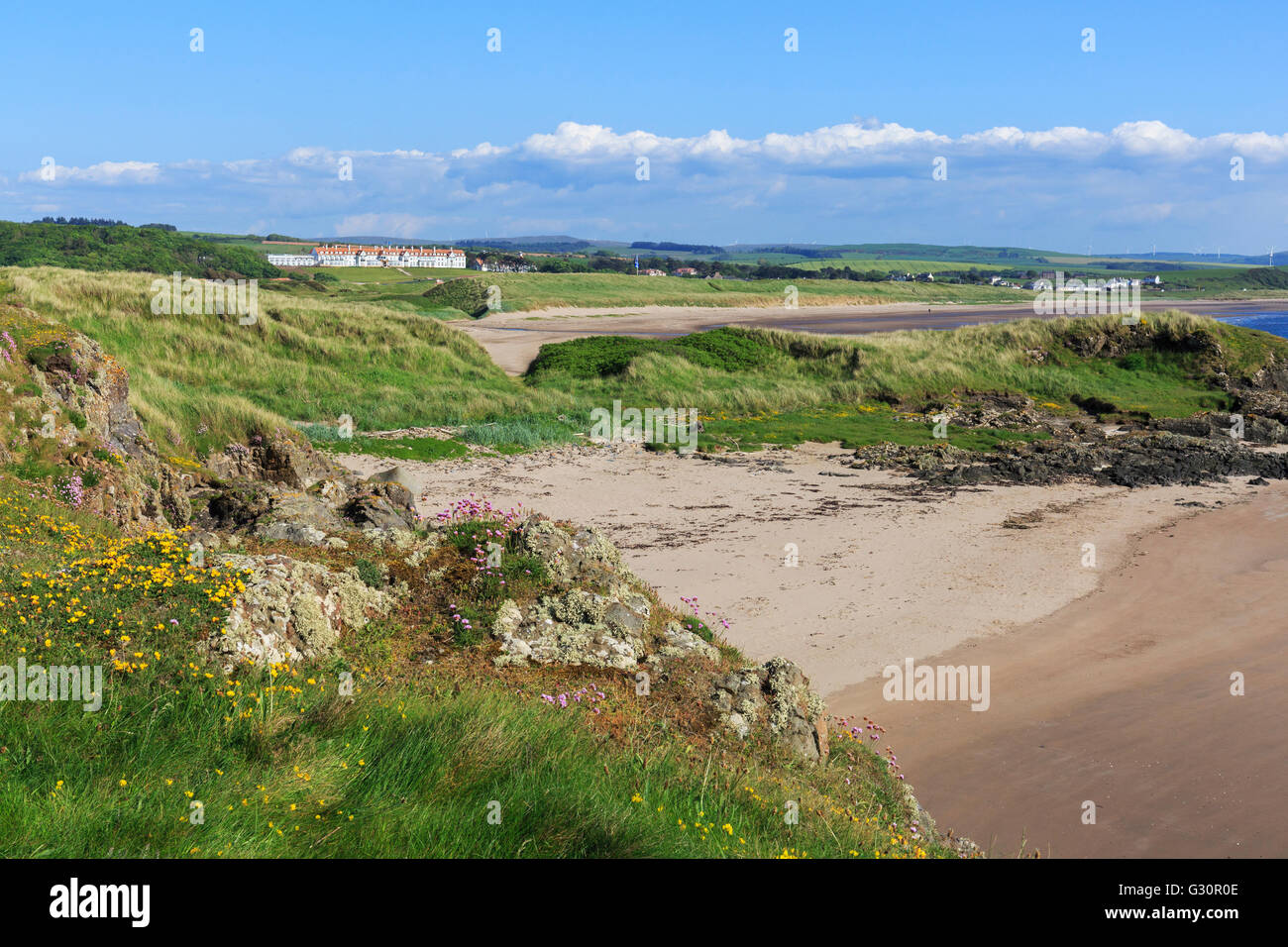Bay at Turnberry on the edge of Trump Turnberry Golf Course showing the Trump Hotel in the distance, Ayrshire, Scotland Stock Photo