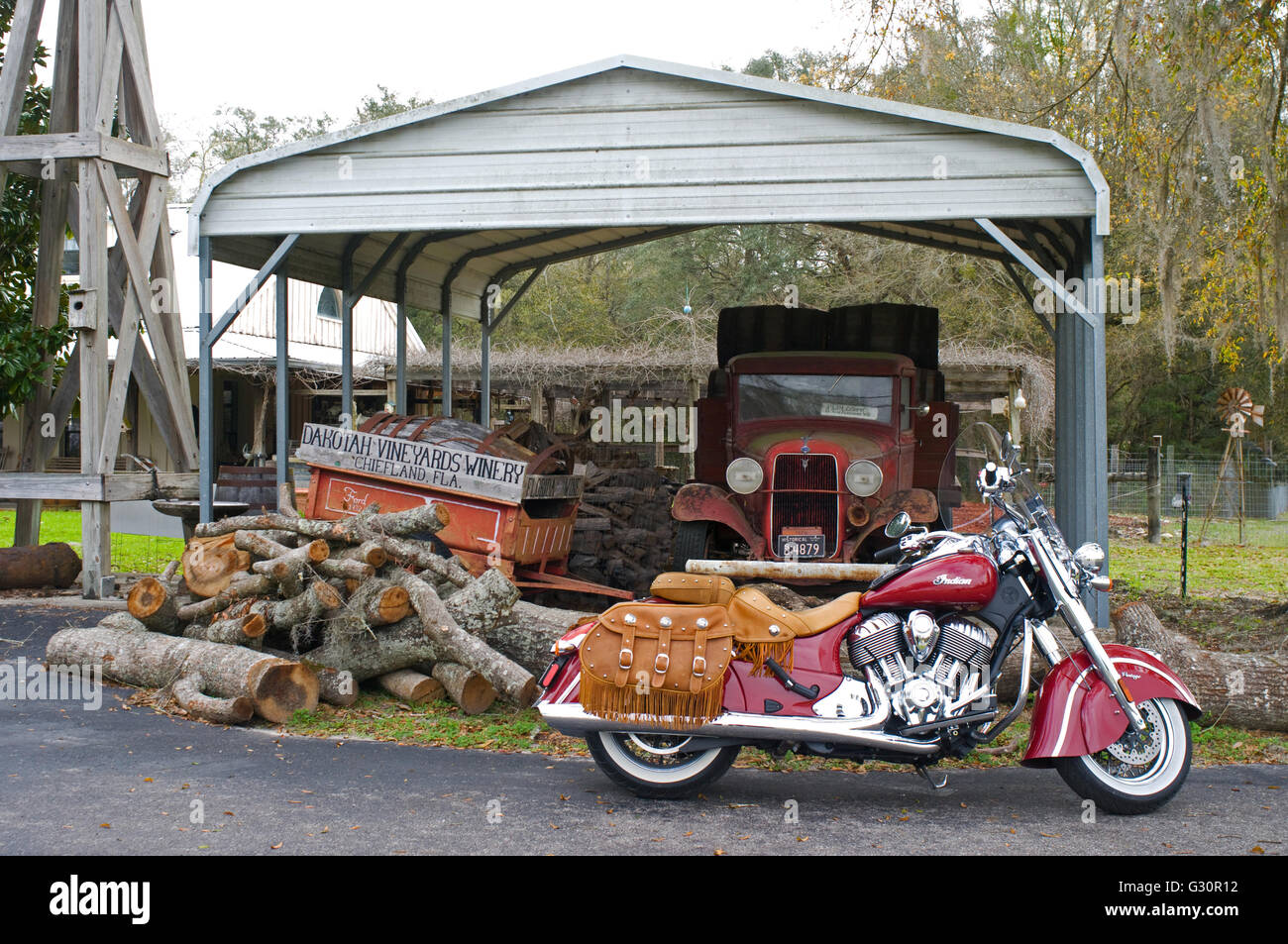 A late model Indian Chief Vintage Motorcycle in parked in front of a rustic background. Stock Photo