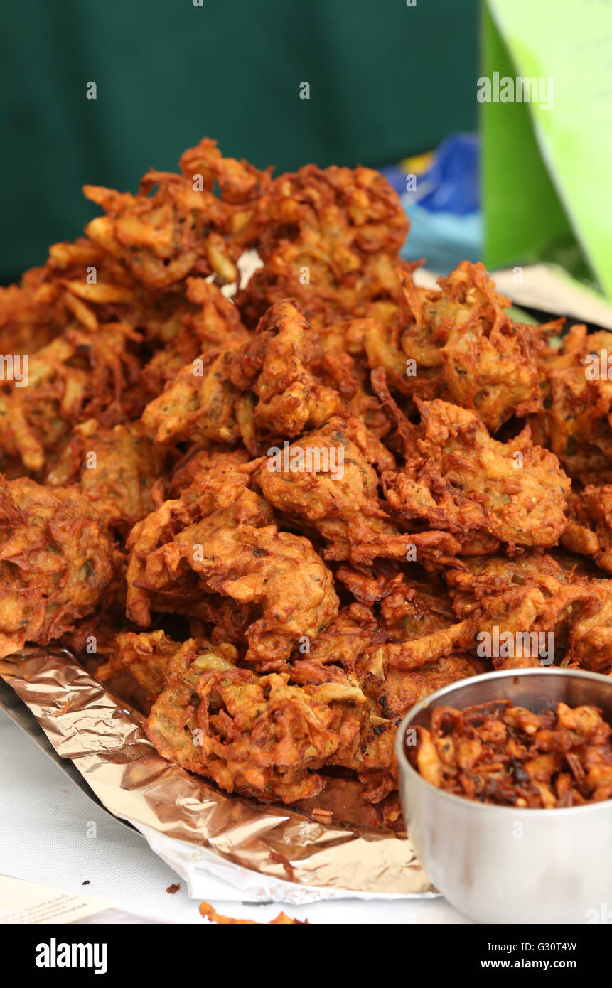 bhajji, bhaji or bajji, is a spicy Indian snack similar to a fritter seen here at a local food market Stock Photo