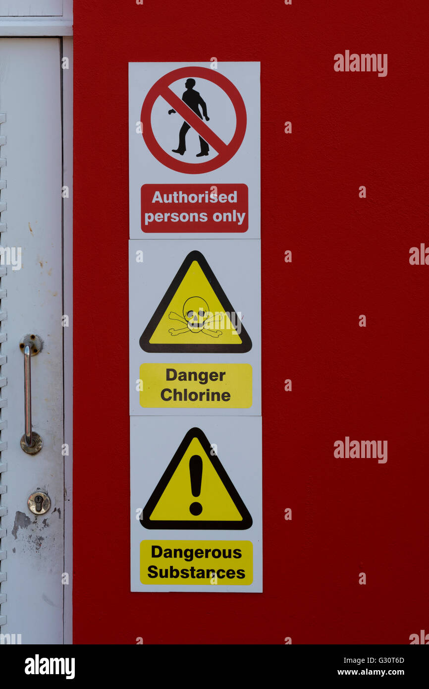 Hazardous chemicals warning signs at a leisure centre, UK Stock Photo
