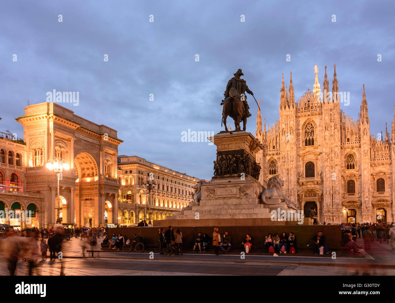 Piazza del Duomo with triumphal arch at the entrance to the Galleria Vittorio Emanuele II , Cathedral and equestrian statue of V Stock Photo