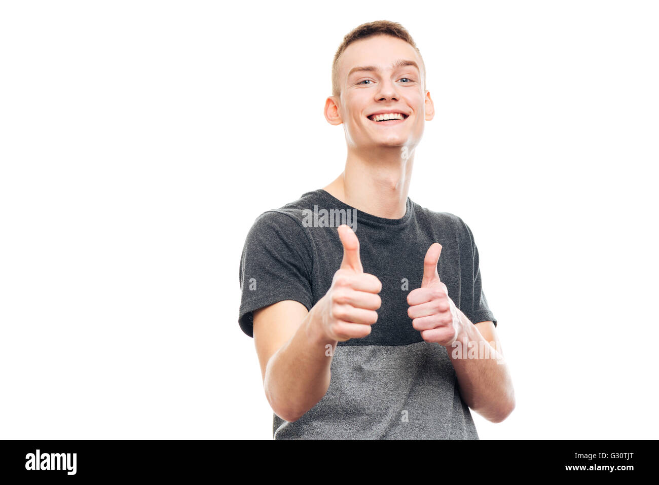 Happy casual man showing thumbs up isolated on a white background Stock ...