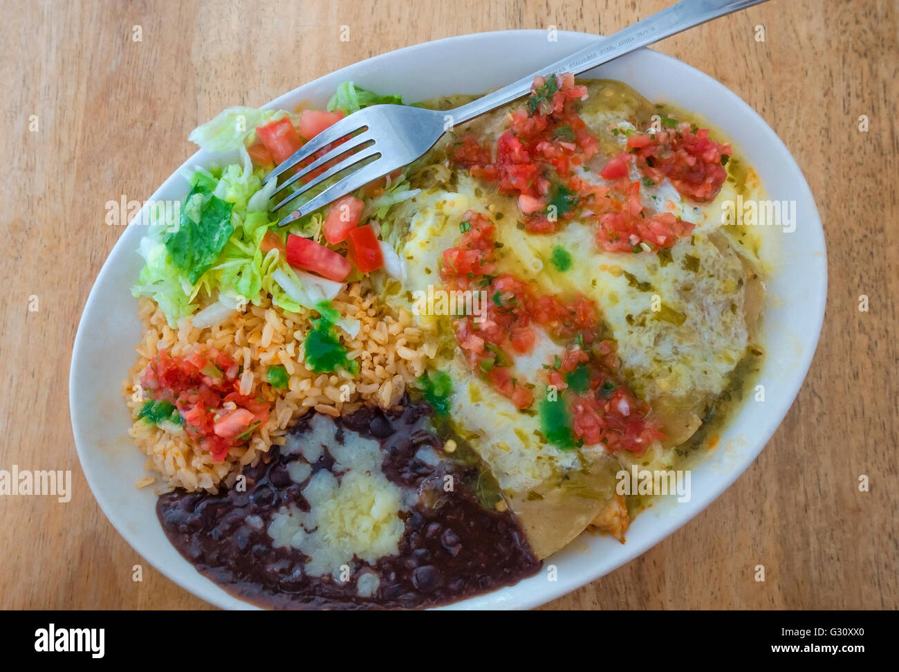 Chicken enchiladas with salsa, black beans, brown rice, salad, cheese ...