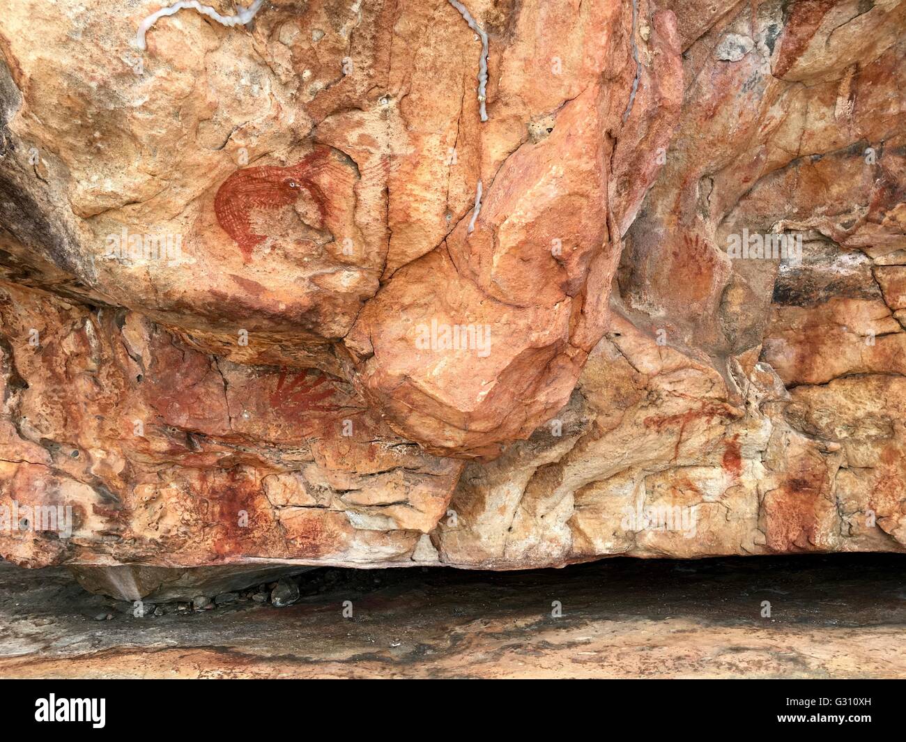 A red prawn painted in a cave known as Shrimp Rock at Hawk Dreaming, Cannon Hill, Kakadu National Park, Australia Stock Photo