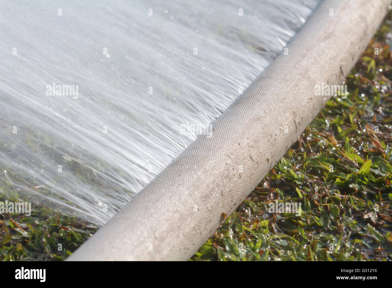 water leaking from hole in a hose Stock Photo Alamy