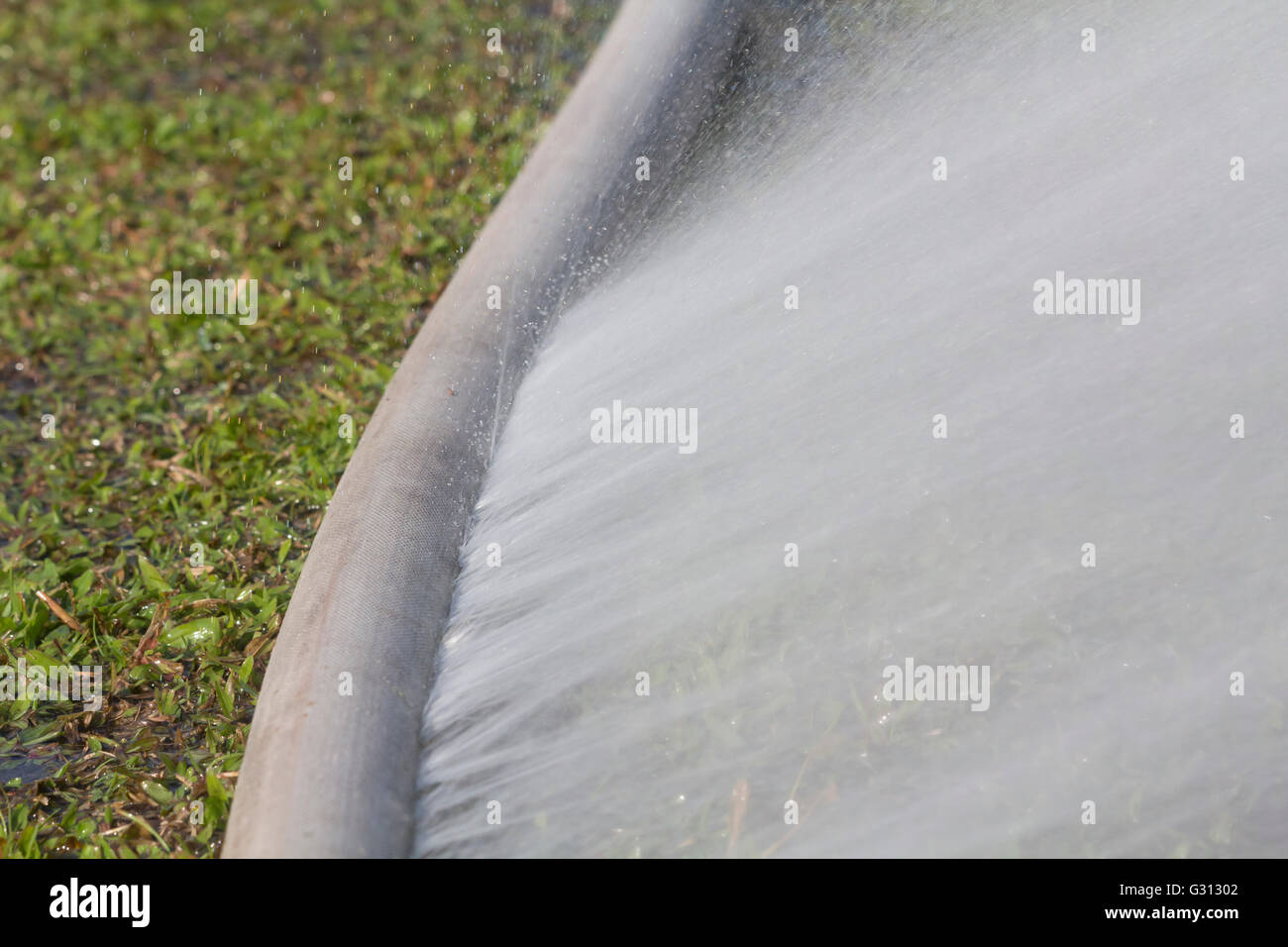 water leaking from hole in a hose Stock Photo Alamy