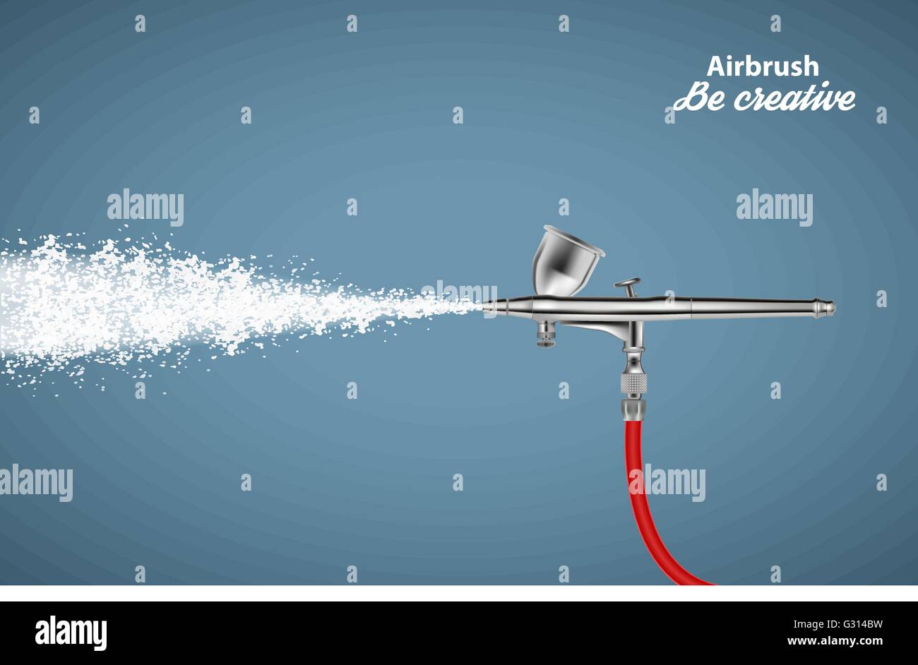 Close up of a airbrush paint sprayer isolated on blue background