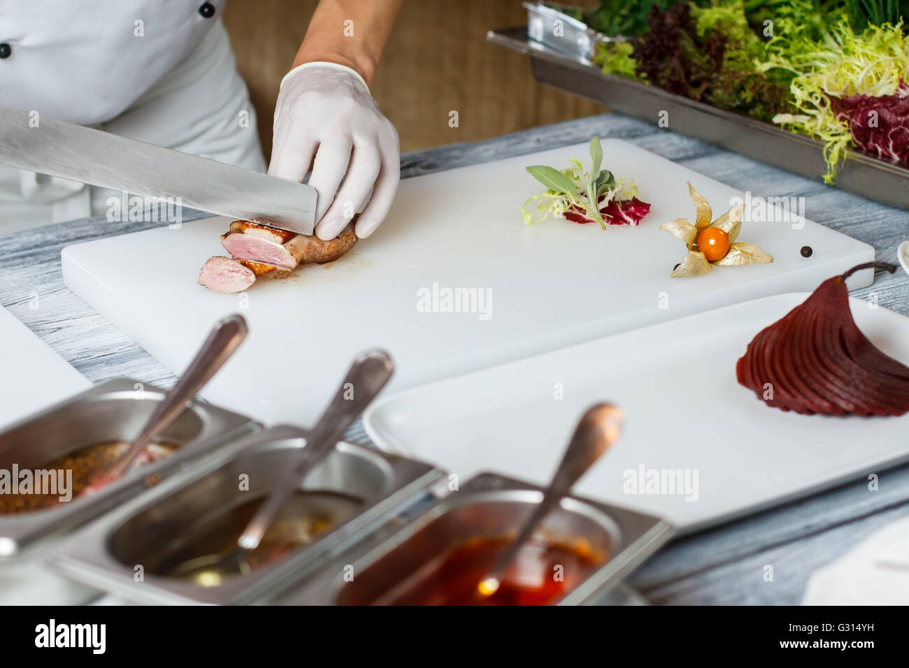 Knife cuts cooked meat Stock Photo Alamy