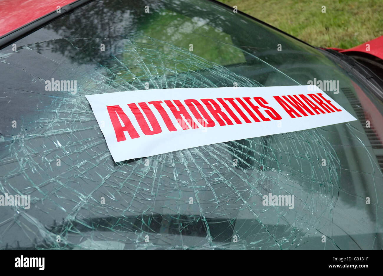 authorities aware sticker on windscreen of crashed car Stock Photo