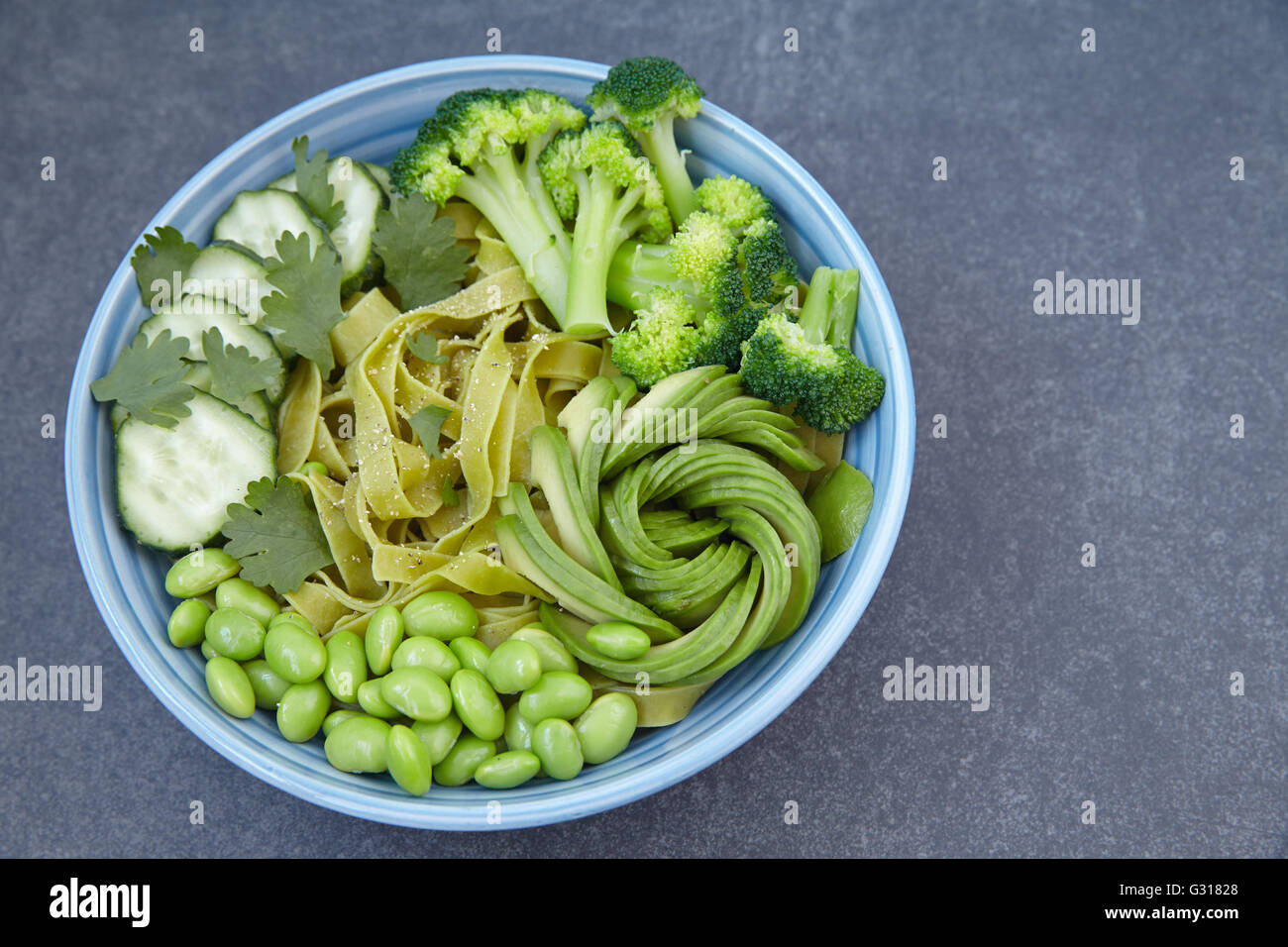 Vegetarian pasta with cucumber, broccoli, avocado and edamame Stock Photo Alamy