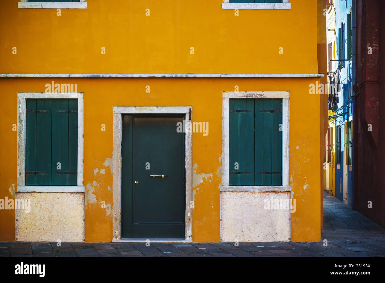 Colorful facades with doors and windows in Burano, Italy Stock Photo ...
