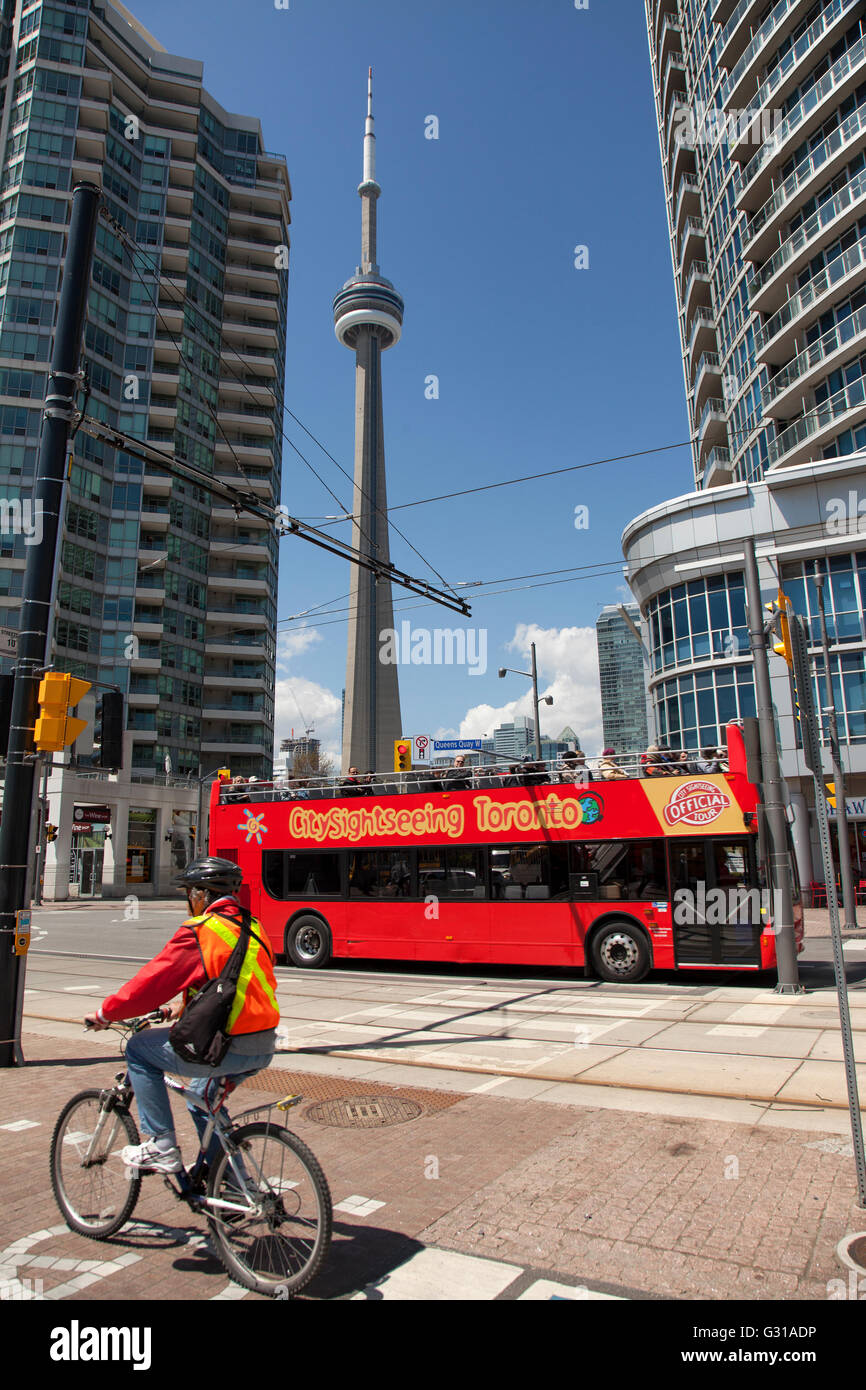 TORONTO - May17, 2016: A hop-on hop-off tour bus is a very popular way to see the major attractions in the city of Toronto. Stock Photo