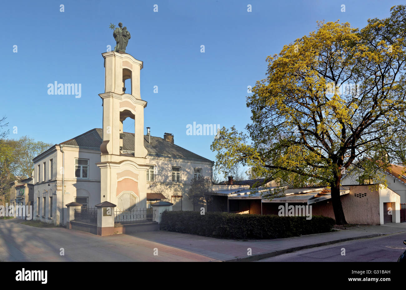 VILNIUS, LITHUANIA - MAY 04, 2016: Bronze depicts Saint Christopher with the infant Jesus in his hands statue on the Jovaro stre Stock Photo