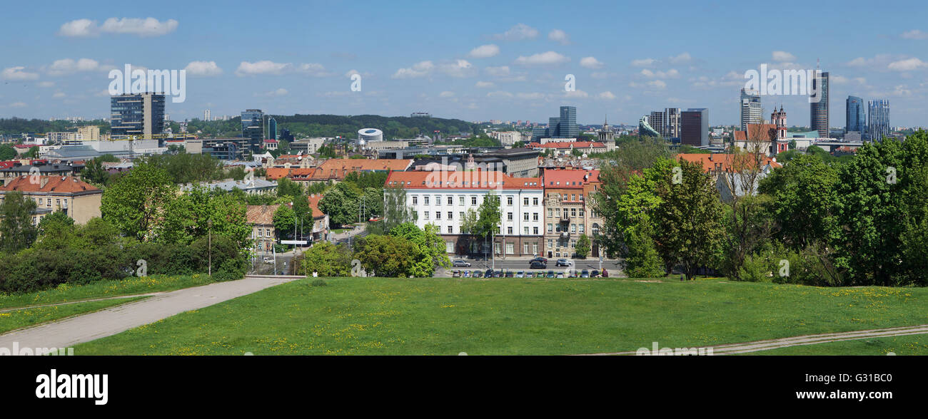 VILNIUS, LITHUANIA - MAY 12, 2016: Panorama of the spring sunny city and public garden from top of the old Tauras mountain. Are Stock Photo