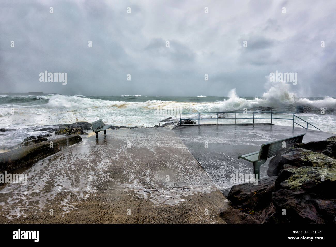 Kiama Rock Pool, Illawarra Coastline, New South Wales, Australia, is buffeted by damaging winds and heavy rainfall during storm Stock Photo
