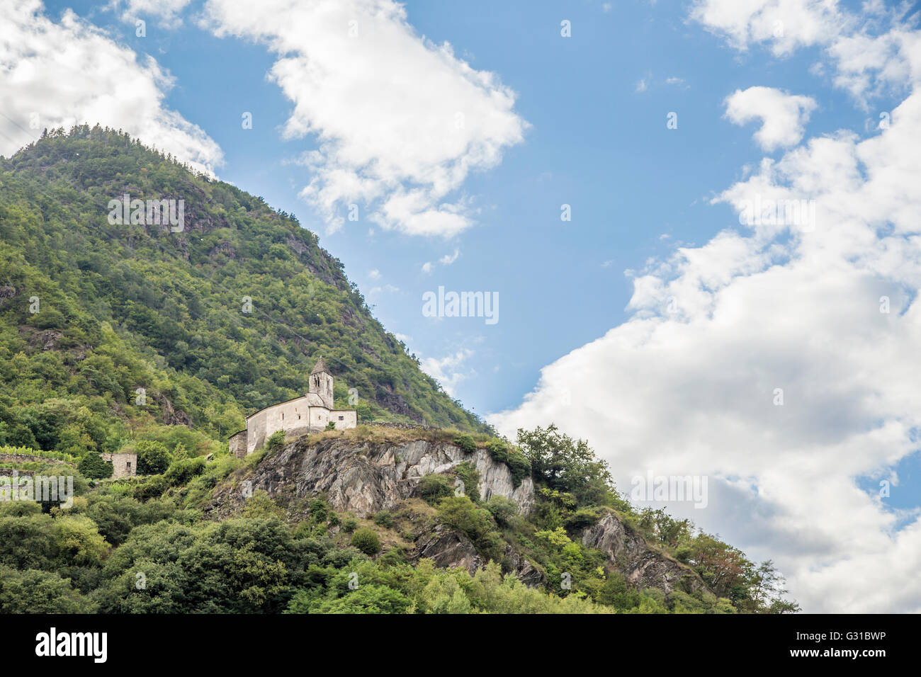 A hermitage perched high on a mountain in Valtellina, on the Bergamasque Alps in Italy Stock Photo