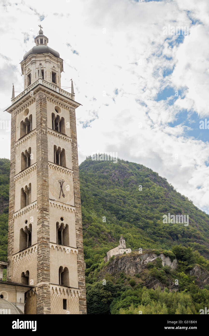 The high tower of the Basilica of Tirano, a town in Valtellina, located in the province of Sondrio in northern Italy Stock Photo