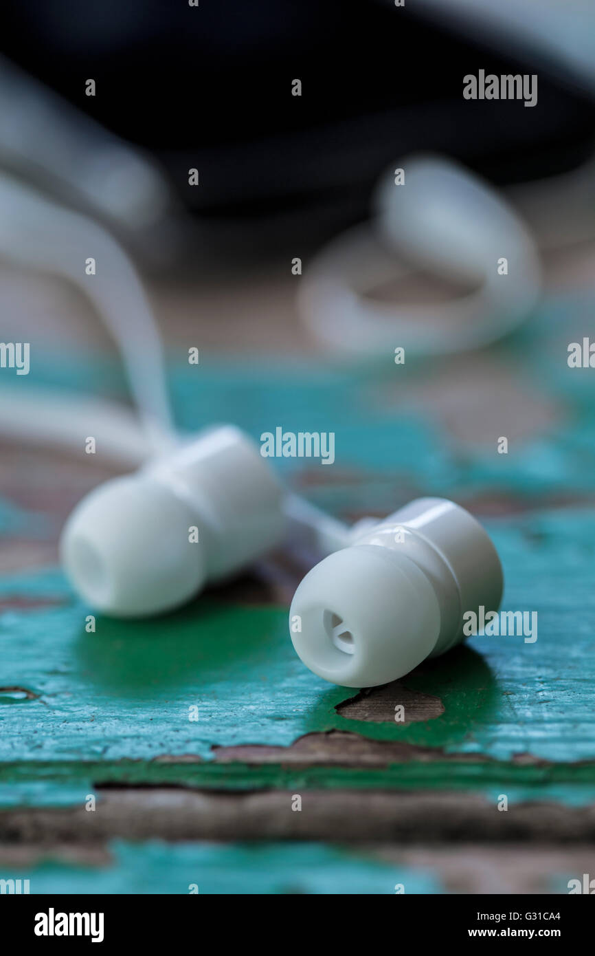 White in-ear headphones. Stock Photo