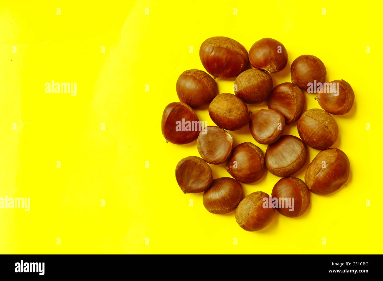 Chestnut pattern on yellow background, top view, horizontal, copy space Stock Photo