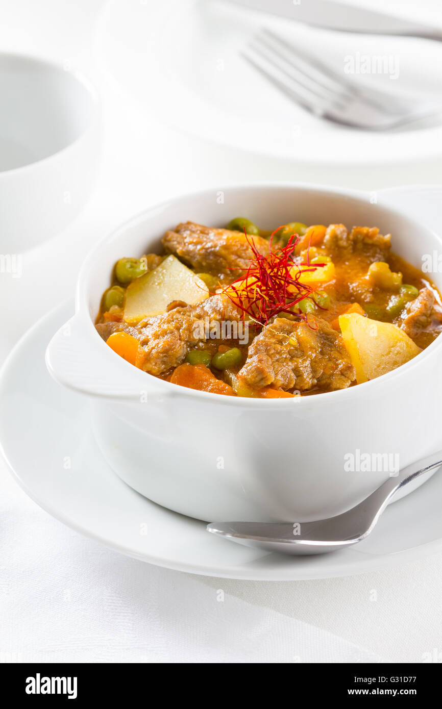 A beef stew with potatoes, carrot and green peas Stock Photo Alamy