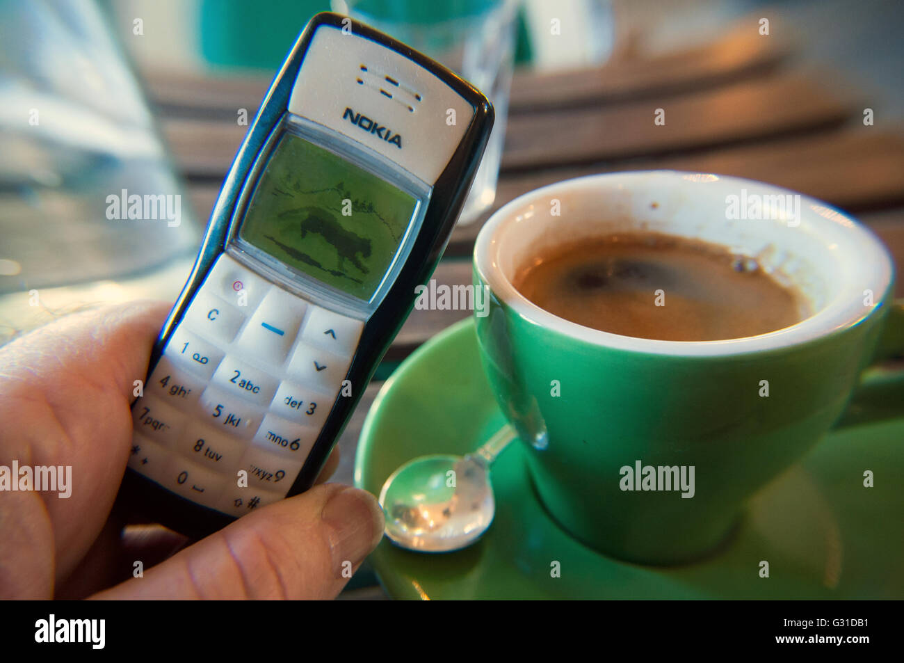 Coffee cup and retro Nokia phone, coffee shop, Melbourne, Victoria, Australia Stock Photo