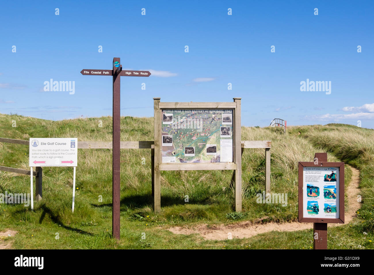 Fife Coastal Path signpost and local information boards by golf course