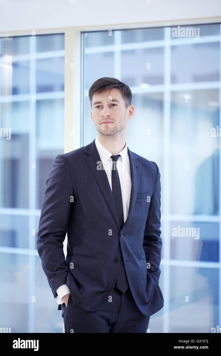 Portrait of a young handsome businessman indoors Stock Photo - Alamy