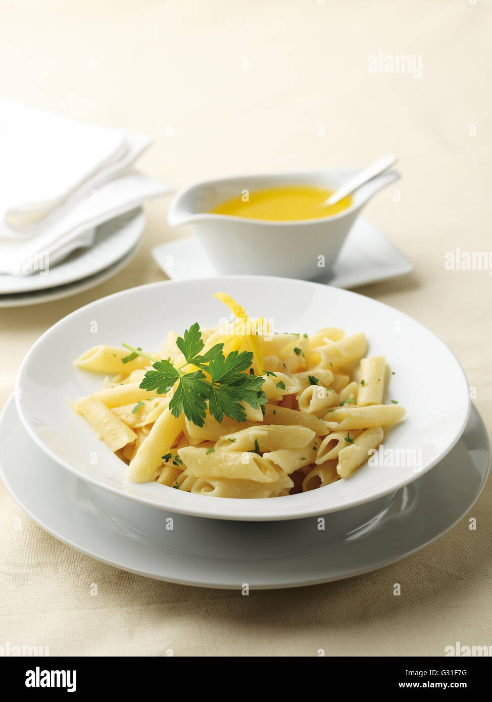 Italian penne pasta served with a butter cream sauce Stock Photo