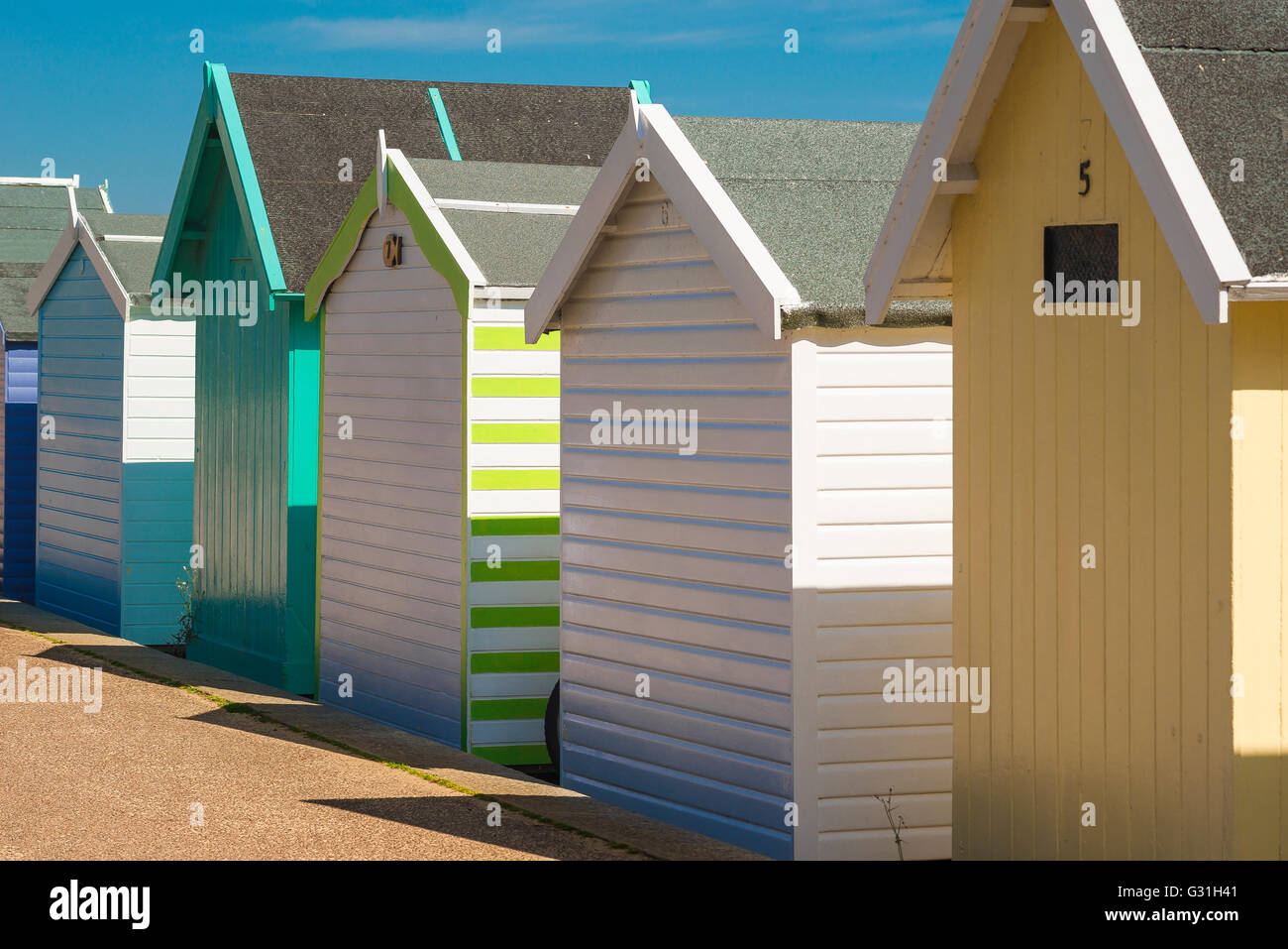 A row of beach huts (rear view) in Felixstowe, Suffolk, England. Stock Photo