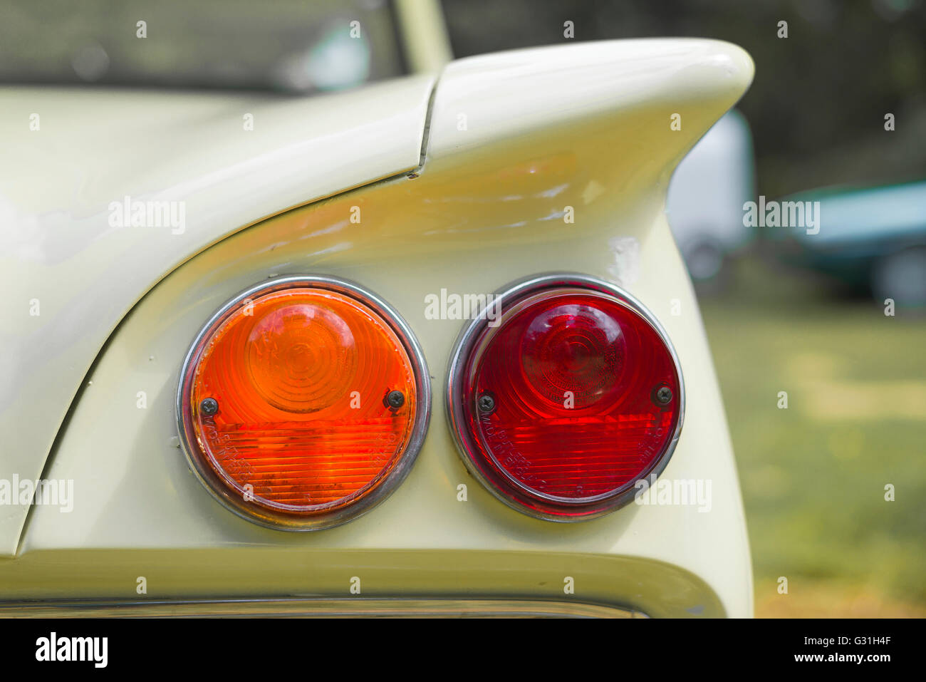 Detail of the rear fin and lights of a 1961 primrose yellow Ford Consul Classic. Stock Photo