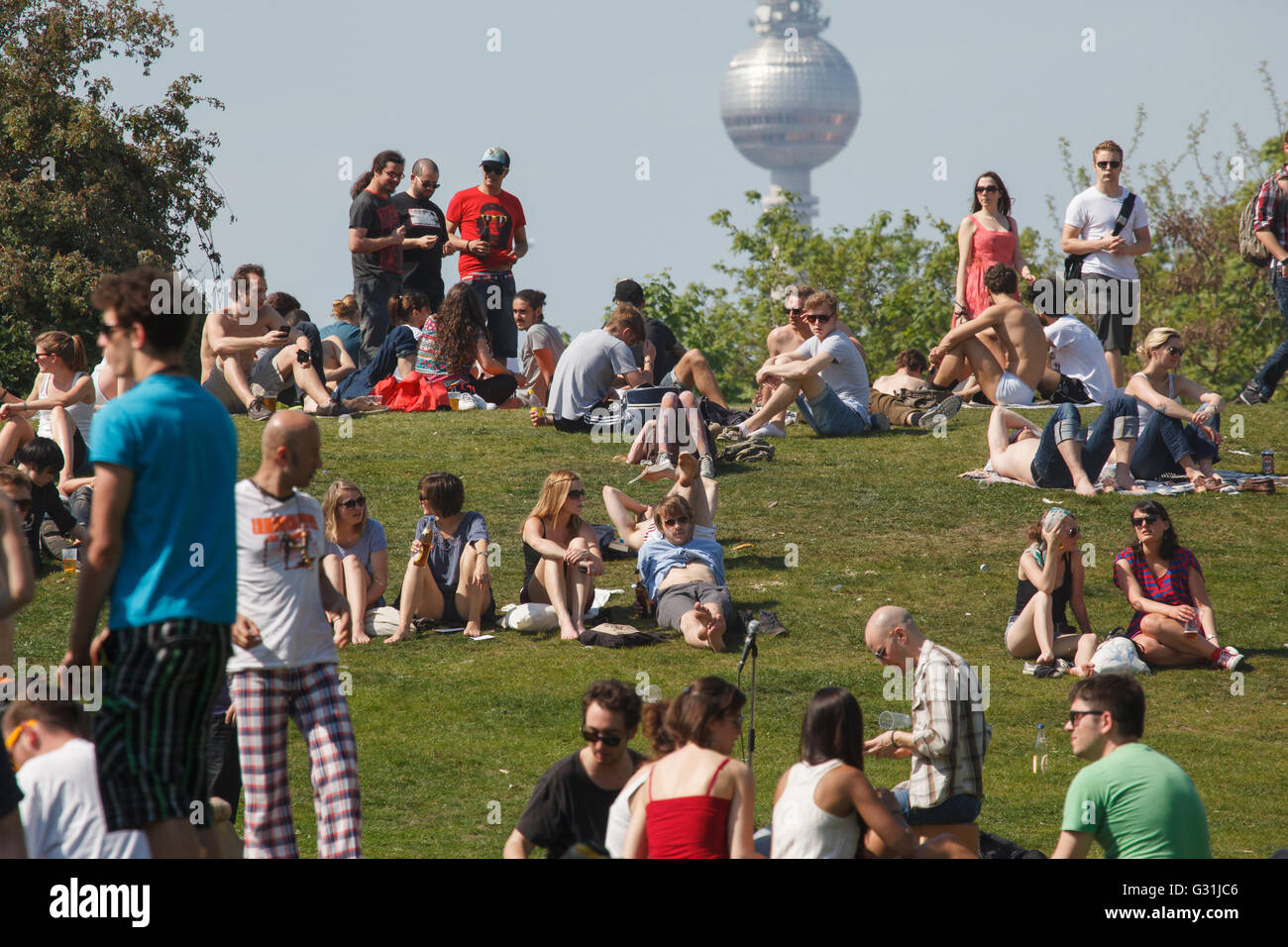 01.05.2012, Berlin, Berlin, Germany - Young people celebrate the MyFest in Goerlitzer Park. Background: television tower. 00F120501D038CAROEX.JPG - NOT for SALE in G E R M A N Y, A U S T R I A, S W I T Z E R L A N D [MODEL RELEASE: NO, PROPERTY RELEASE: NO (c) caro photo agency / , http://www.caro-images.pl, info@carofoto.pl - In case of using the picture for any purposes, please contact the agency - the picture is subject to royalty!] Stock Photo