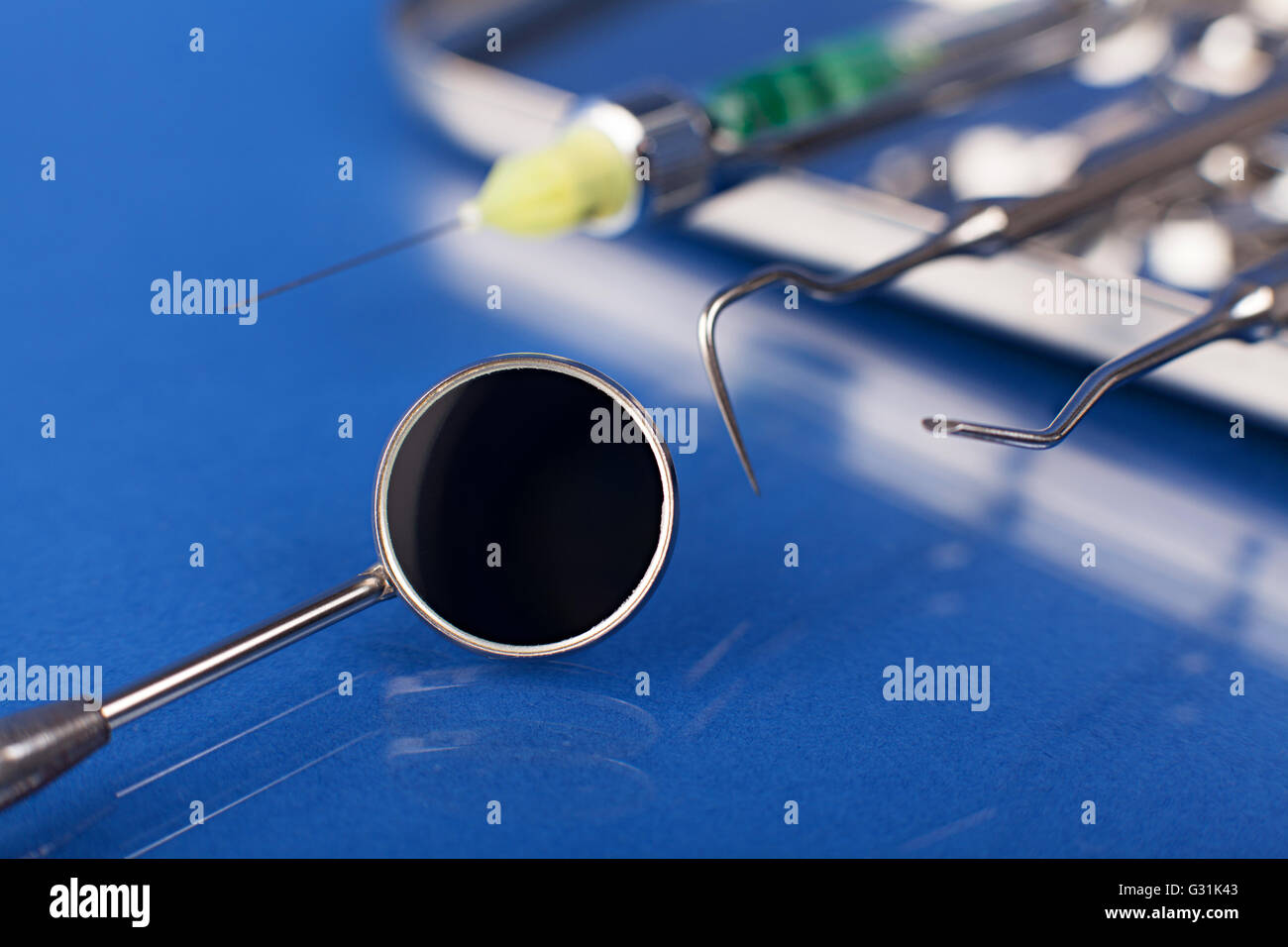 dentist tools on a blue Stock Photo Alamy