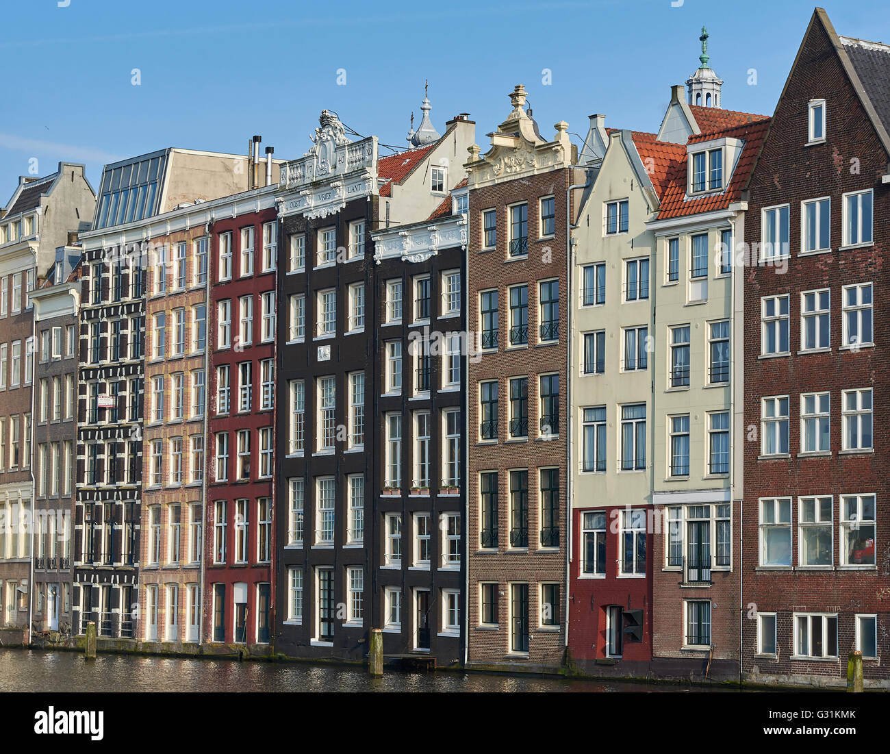 Amsterdam, Netherlands – March 10, 2016: Canal houses in Amsterdam, with blue skies in the background Stock Photo