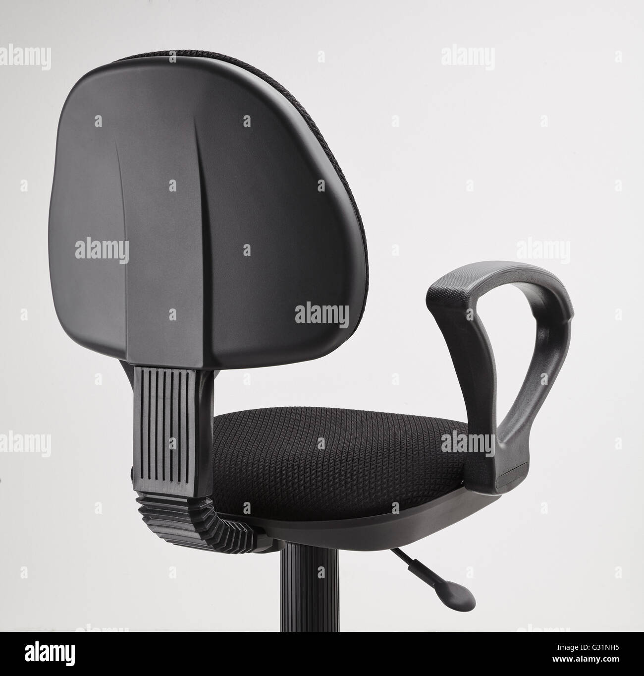 back view of black office swivel chair on wheels with a