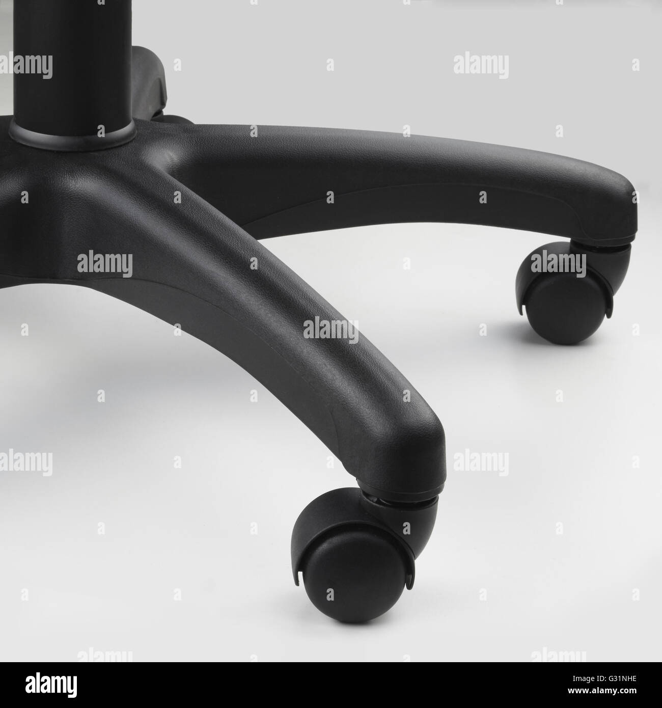Close up view of the rollers of black office swivel chair on wheels