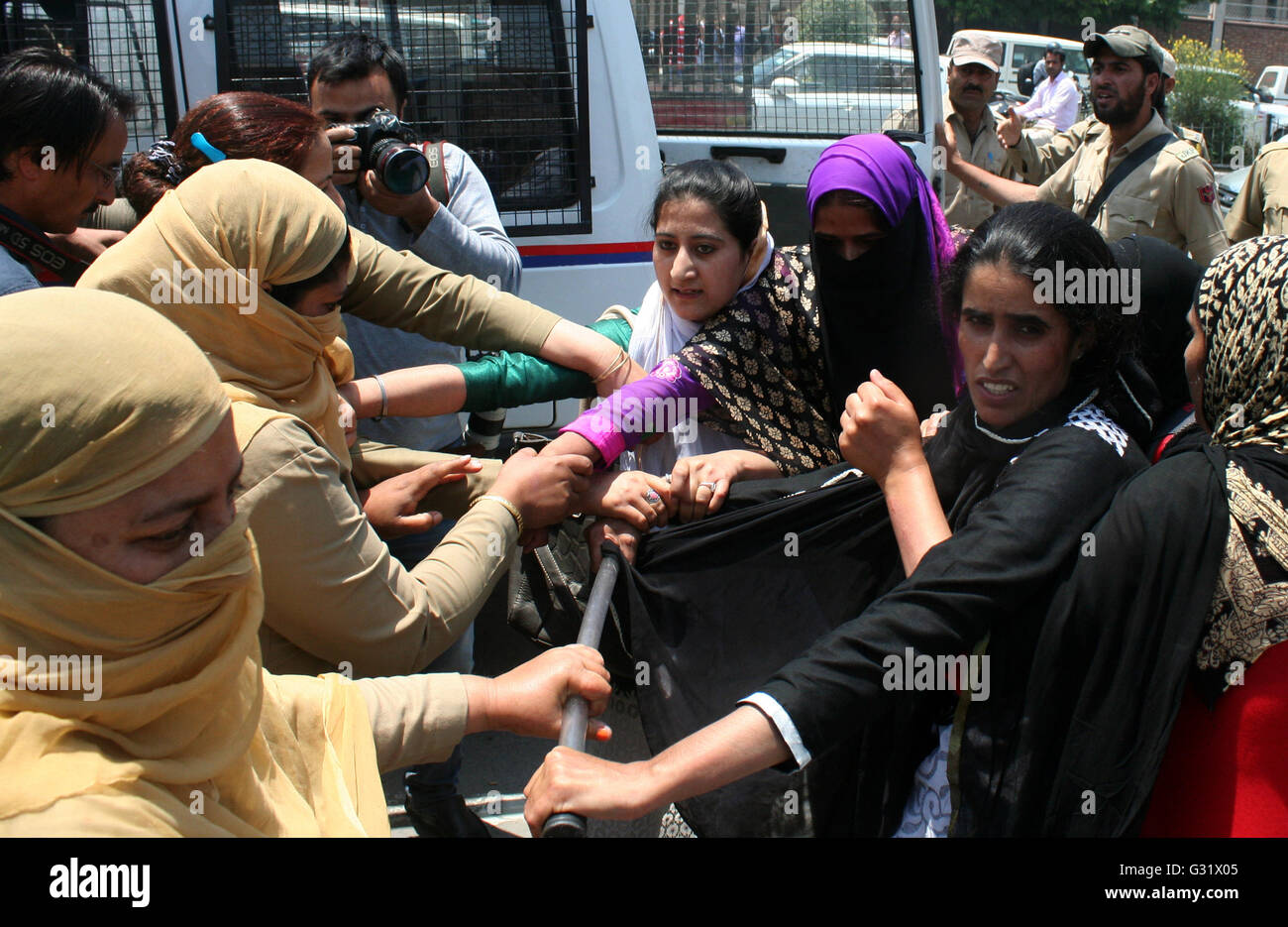Srinagar, Indian Administered Kashmir:06 june .Indian women Police detain Saakshar Bharat Mission (SBM) employees during their protest demonstration in support of their long pending demands including release of their pending salaries, near about 6000 thousand contractual employees were engaged under the scheme  utside Civil Secretariat in Srinagar on Monday Credit: Sofi Suhail/Alamy Live News Stock Photo