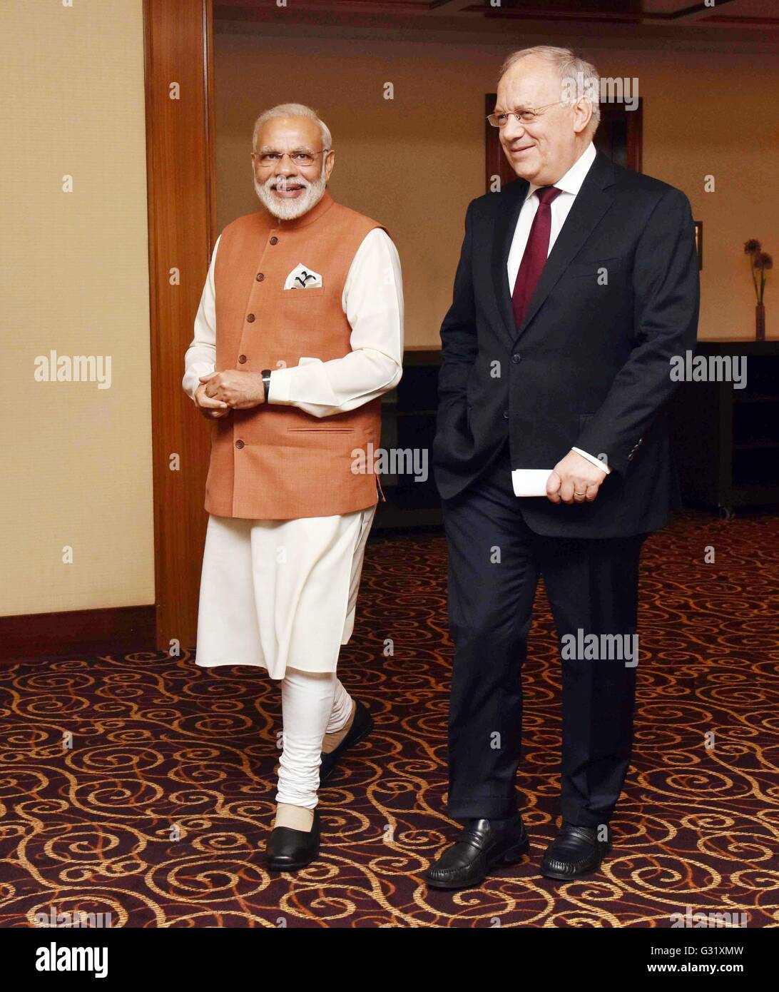 Swiss President Johann Schneider-Ammann walks with Indian Prime Minister Narendra Modi before their bilateral meeting June 6, 2016 in Geneva, Switzerland. Stock Photo