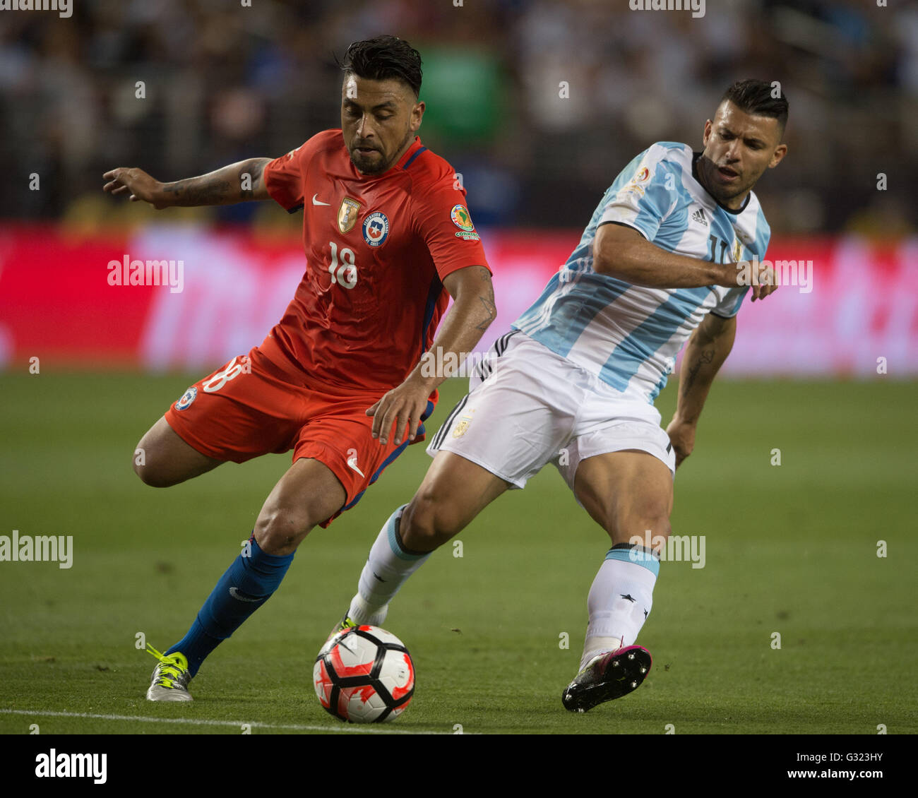 Santa Clara, USA. 6th June, 2016. Argentina's Sergio Aguero (R) vies with Chile's Gonzalo Jara during their Copa America Centenario Group D match at the Levi's Stadium in Santa Clara, California, the United States, June 6, 2016. Argentina won by 2-1. Credit:  Yang Lei/Xinhua/Alamy Live News Stock Photo