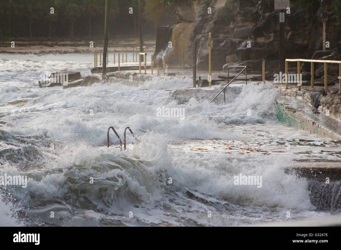 Sydney, Australia. 06th June, 2016. Waves crash onto Marine Parade, the walkway from Manly Beach to Shelly Beach, which has been severely damaged in the storms. Credit:  Max Crane/Alamy Live News Stock Photo