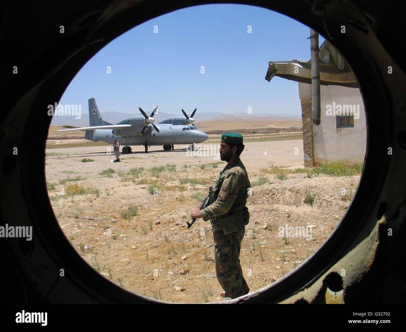 (160607) -- BEIJING, June 7, 2016 (Xinhua) -- File photo taken by Zabihullah Tamana on June 24, 2004 shows an Afghan National Army (ANA) soldier guarding the airport in Chaghcharan, capital of Ghor Province in central Afghanistan. David Gilkey of U.S. National Public Radio (NPR) and his translator Zabihullah Tamana were killed as militants attacked an Afghan army convoy in the southern Helmand province on June 5, 2016. Zabihullah Tamana, 38, served as photojournalist for Xinhua News Agency Kabul bureau from 2003 to 2010. (Xinhua/Zabihullah Tamana) (djj) Stock Photo