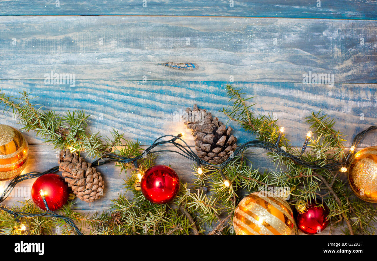 Christmas background with fir branches,pinecones and berries on the old ...