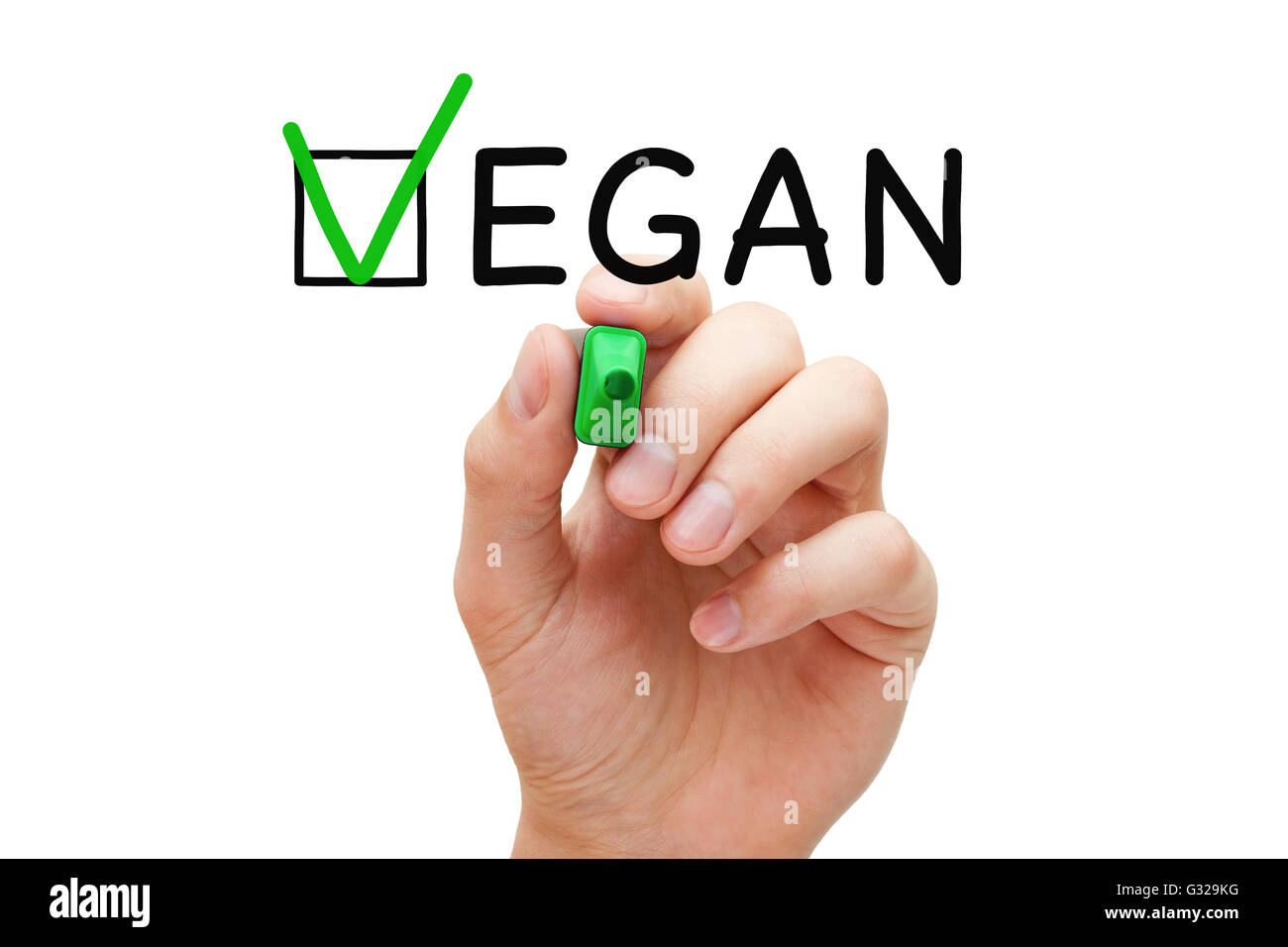 Hand putting check mark with green marker on the tick box in Vegan survey form. Stock Photo