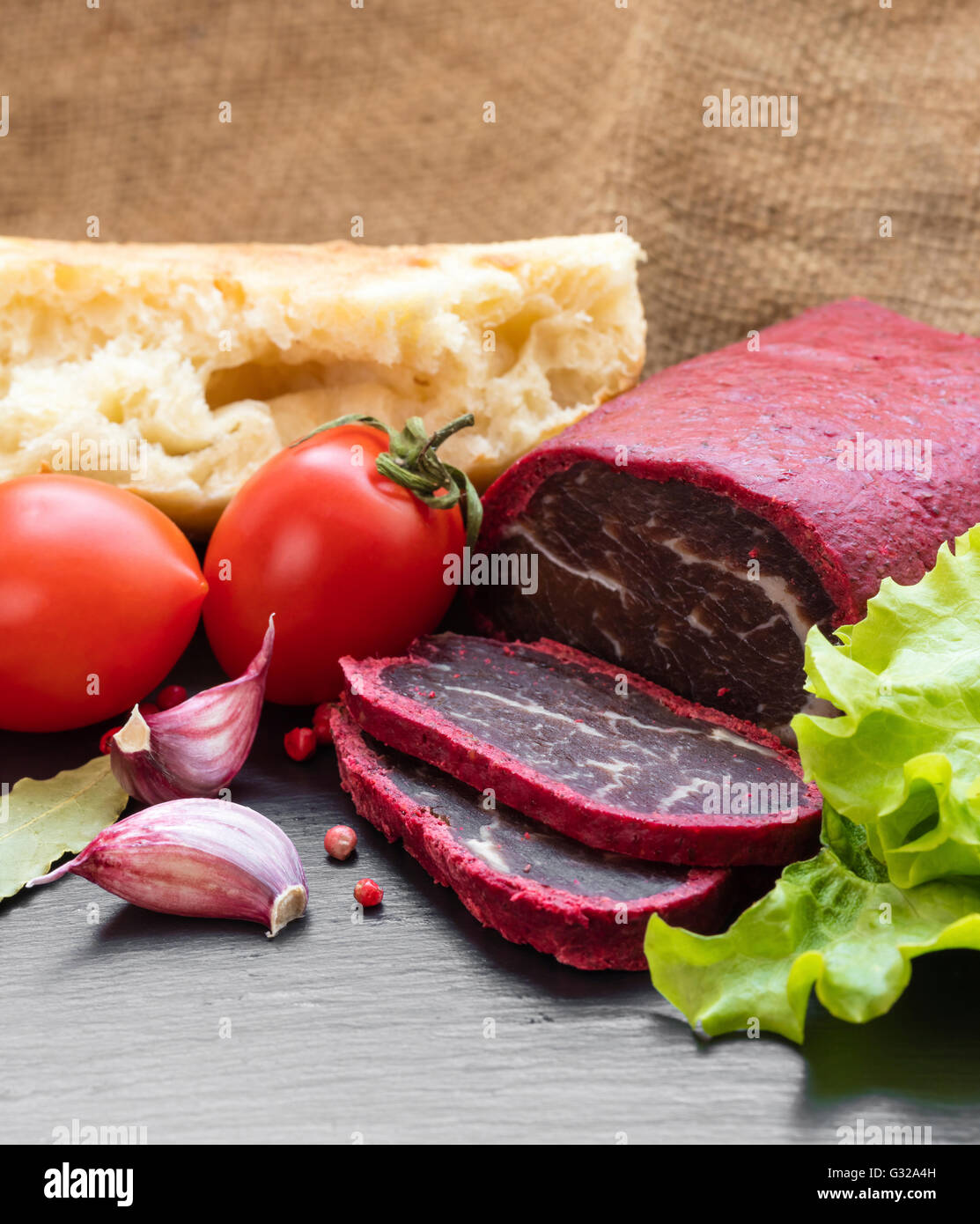 jerky in spices with bread and vegetables Stock Photo Alamy