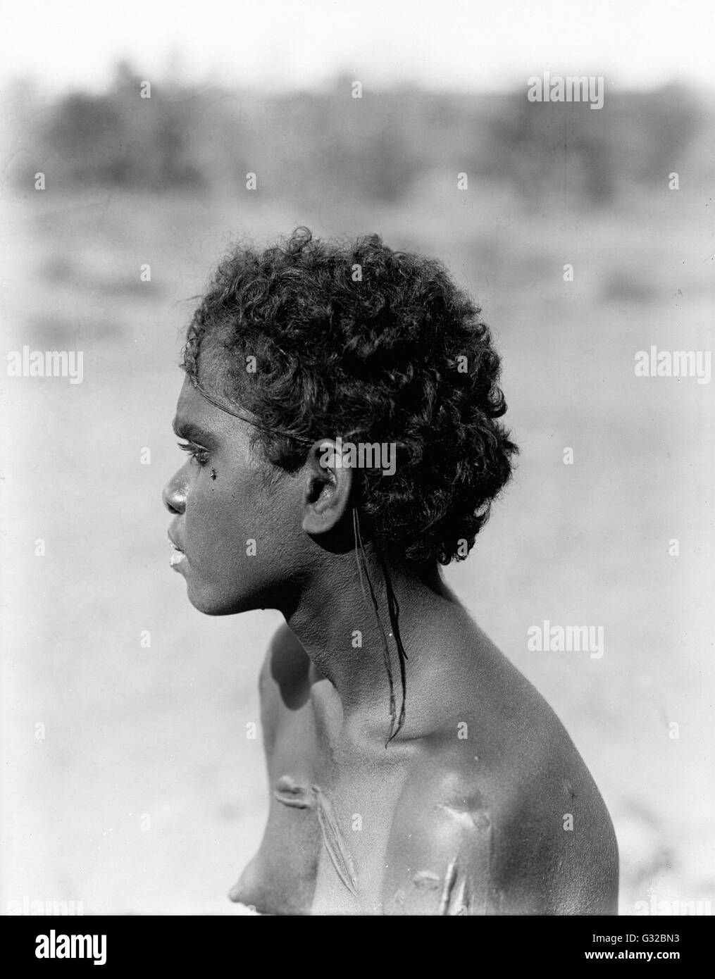 Walter Baldwin Spencer and Francis J Gillen - Young Jingili woman with plaited hair, Powell Creek, Central   - Museum Victoria, Carlton Australia Stock Photo