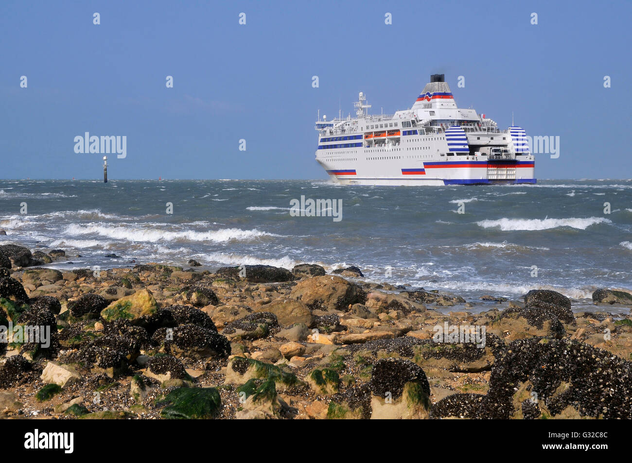 Car ferry outgoing of port of Ouistreham towards England. Calvados department in the Basse-Normandie region of France Stock Photo