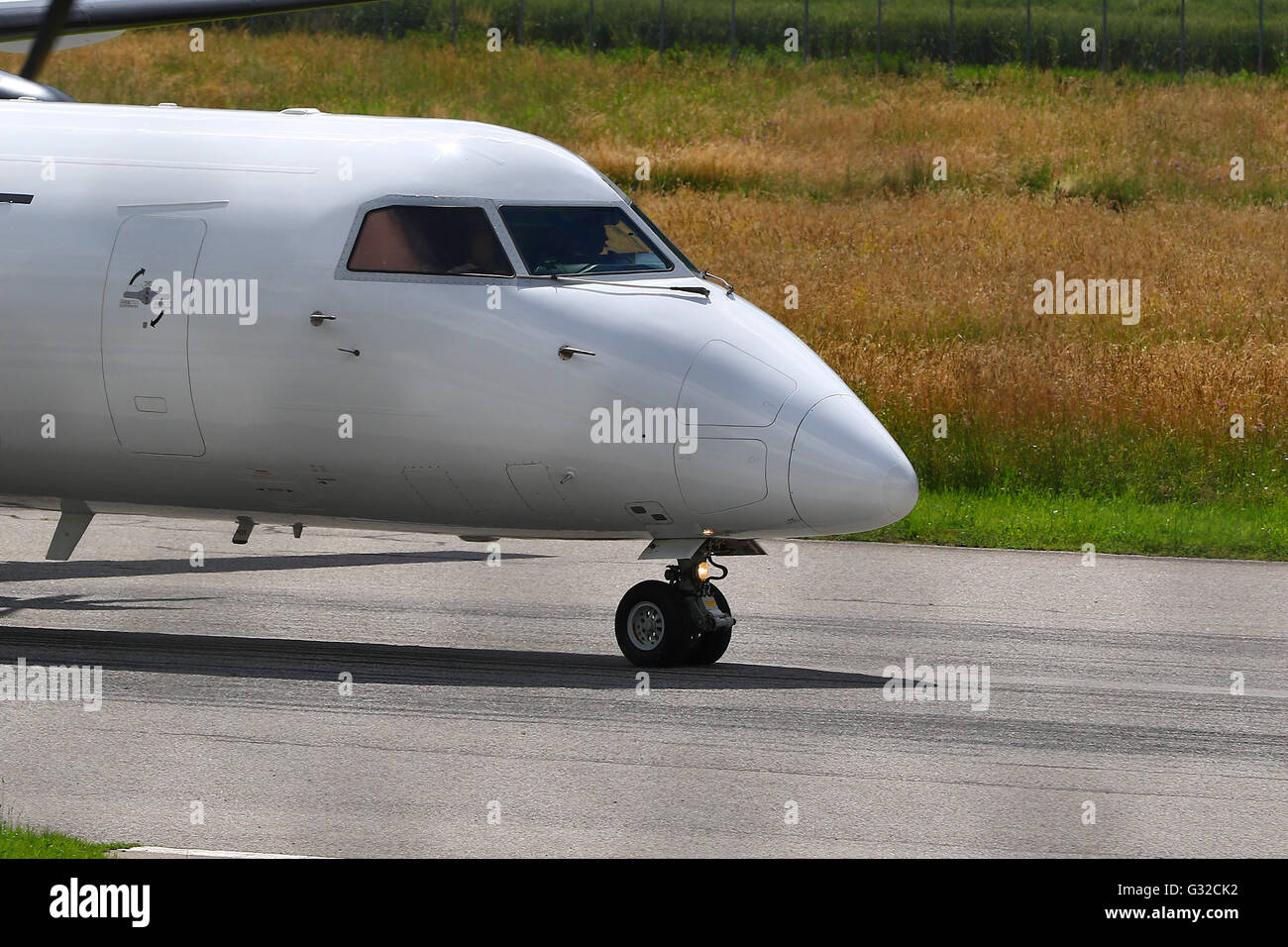 Commuter airline airplane on rolling take off on a runway Stock Photo
