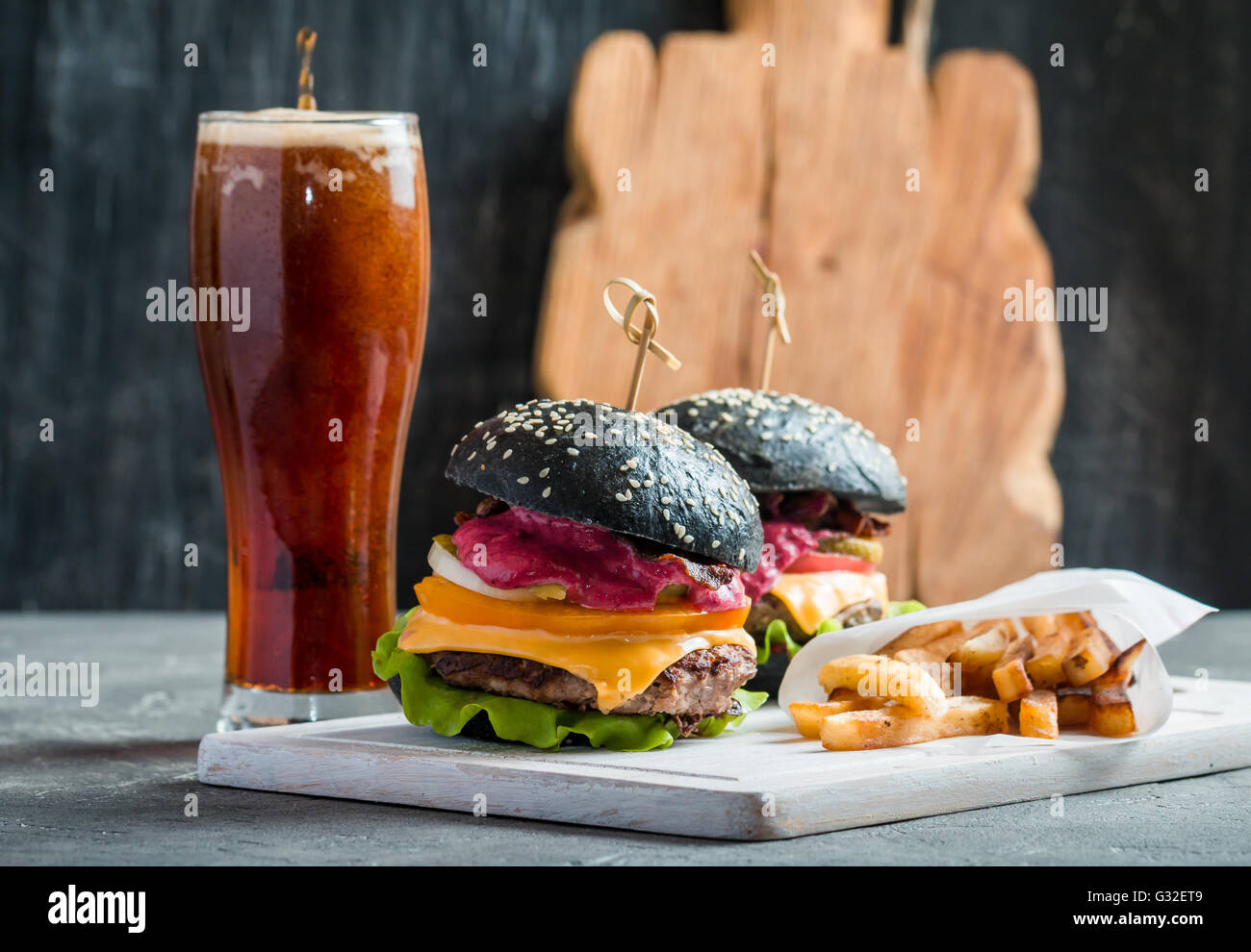 Homemade burger with black bun Stock Photo