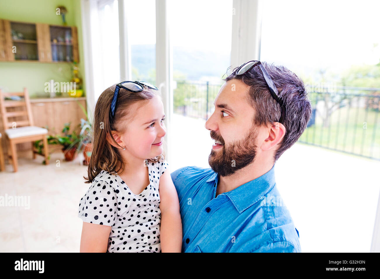 Father with his little daughter making funny face Stock Photo