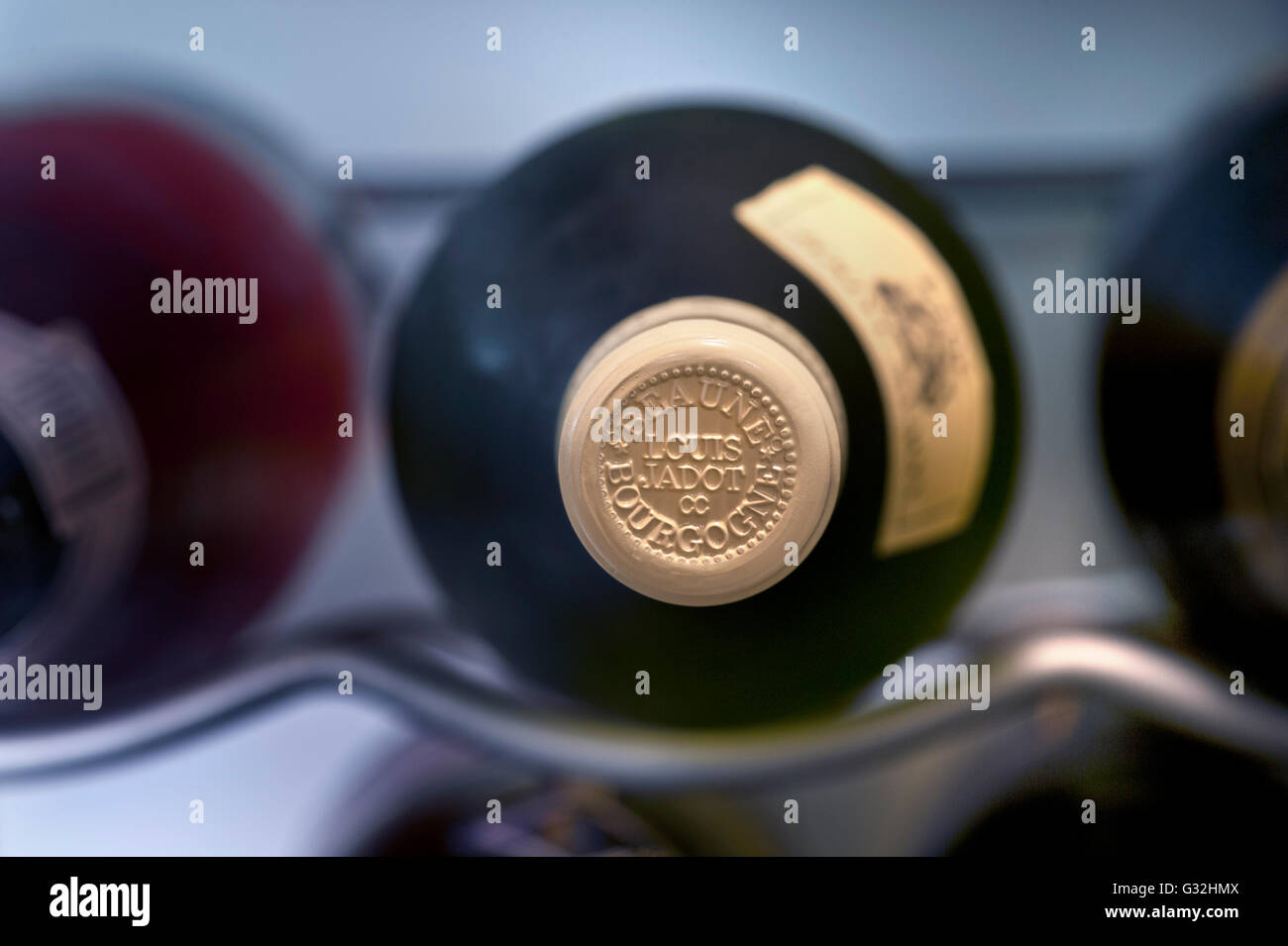 Louis Jadot encapsulation bottle top fine white Burgundy wine bottle stored in controlled temperature wine cabinet Stock Photo