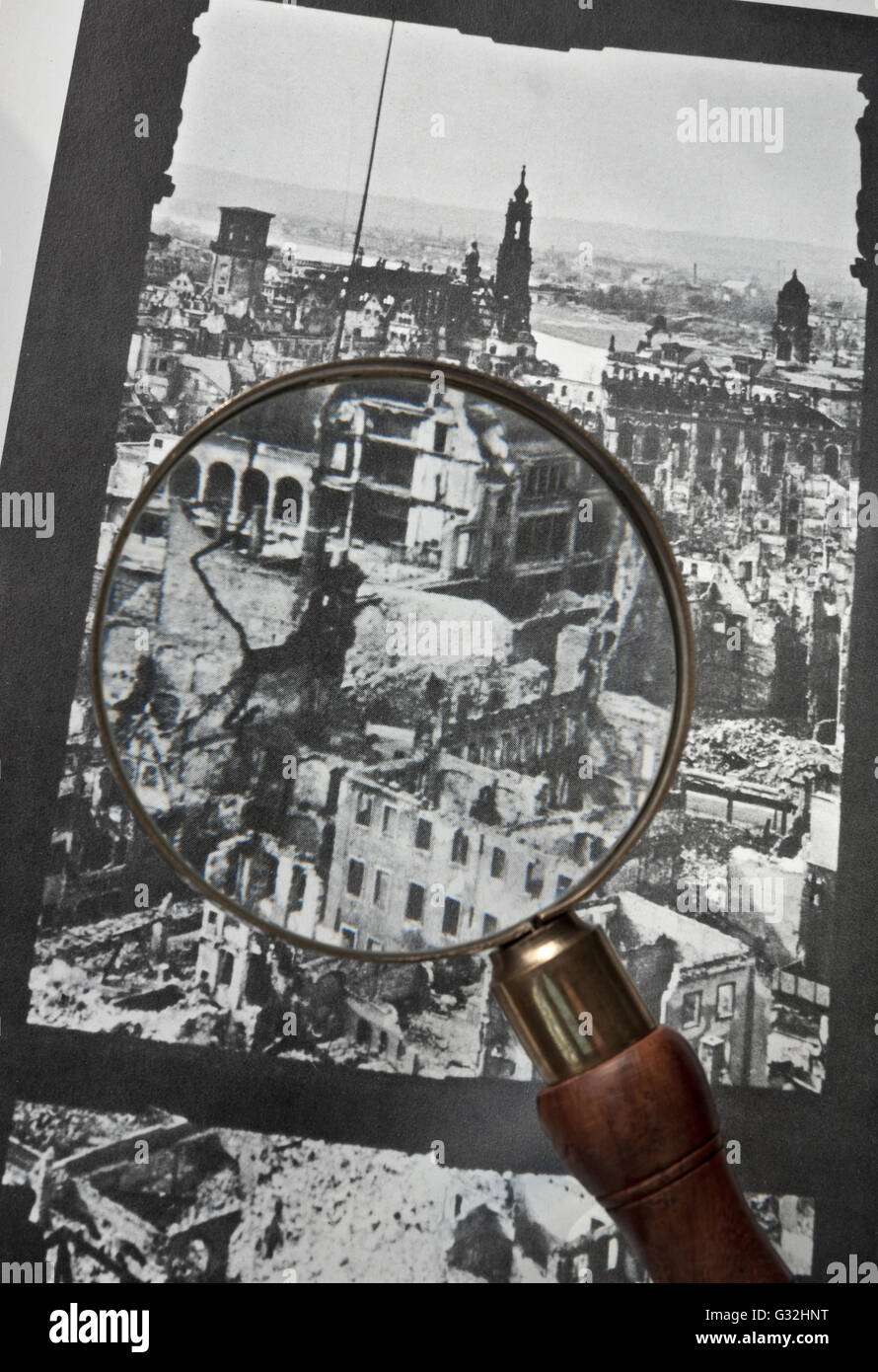 DRESDEN BOMBING Magnifying glass viewing detail on B&W image of German city of Dresden which was almost destroyed by allied bombing in WW2 Stock Photo